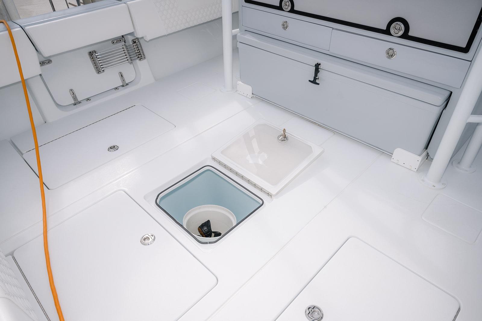 2024 Contender 44 ST boat deck with storage compartments and sleek design.