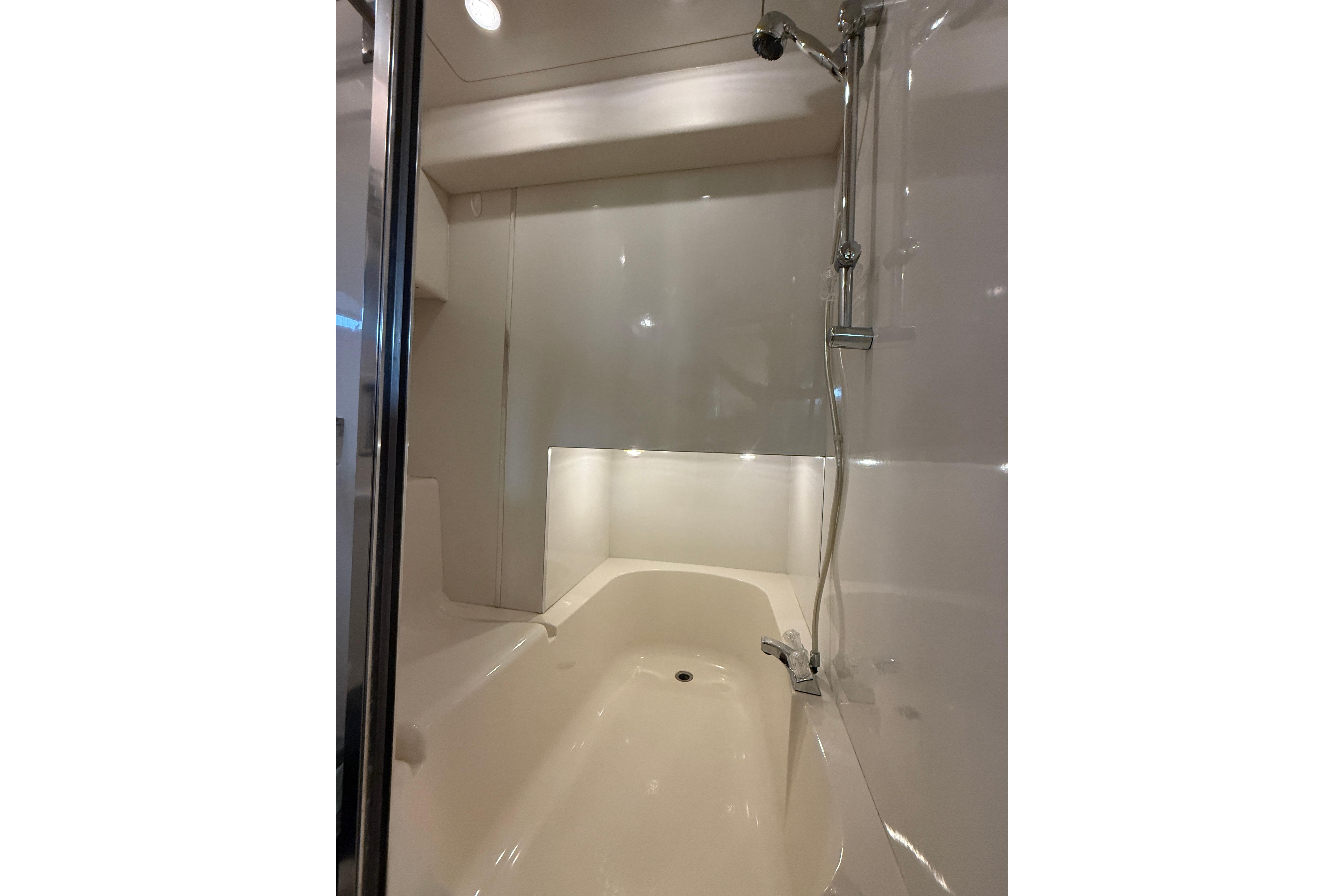 Luxurious bathroom in 1997 Bayliner 3988 Command Bridge Motoryacht with modern shower.