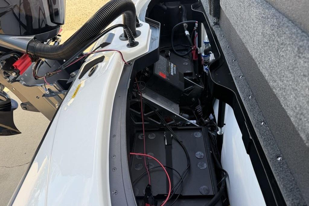 Interior view of a 2026 Skeeter ZXR19 SE boat, showcasing engine and wiring components.