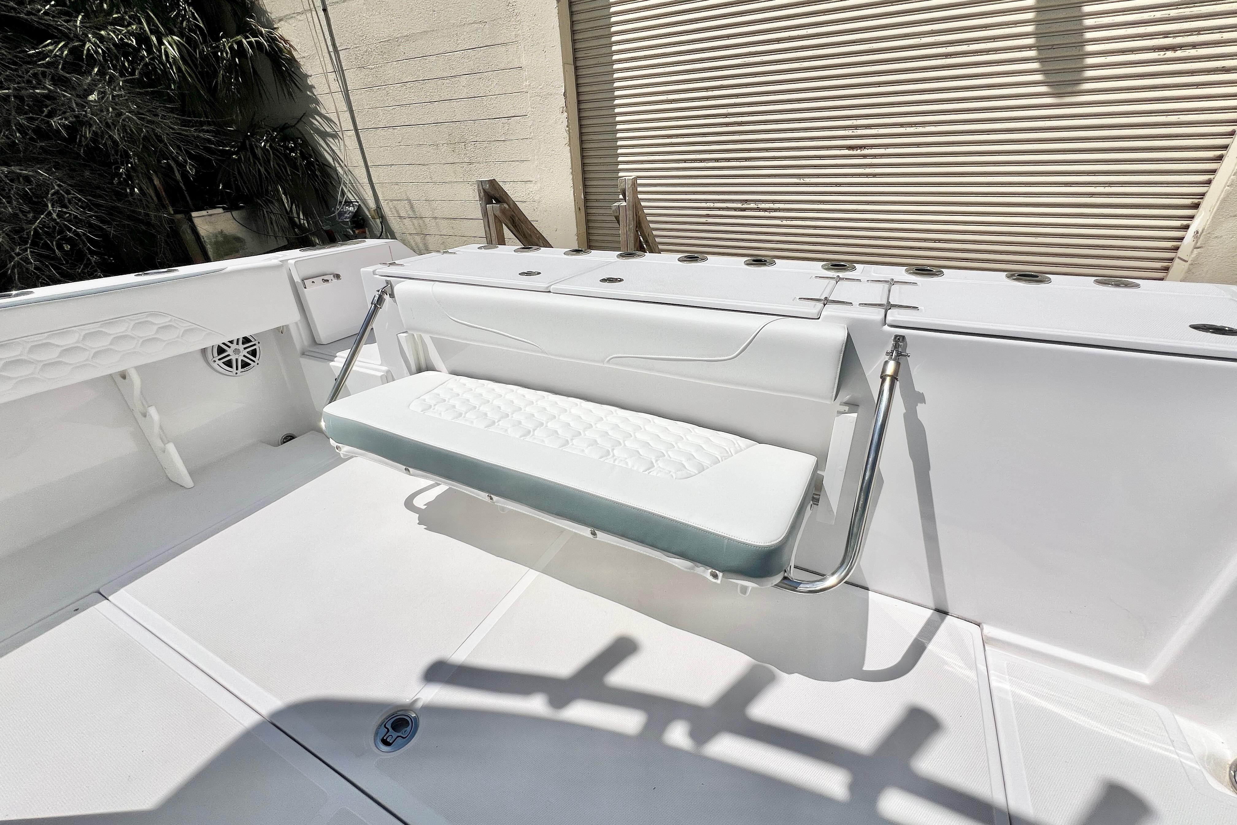 2026 Stamas 31T Aventura boat interior with foldable seating and rod holders.