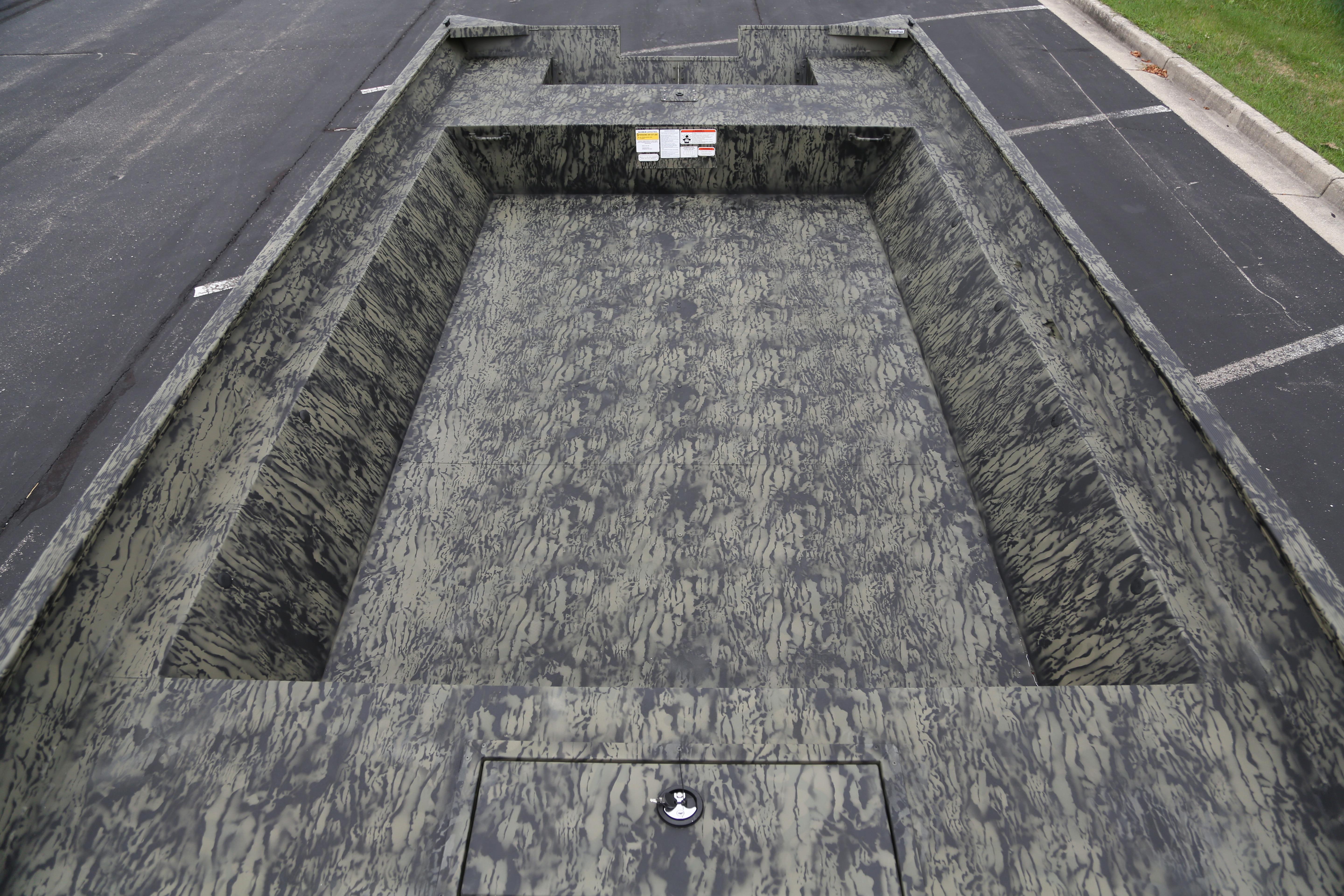 2026 Tracker GRIZZLY 2072 Utility boat with camouflage interior design.