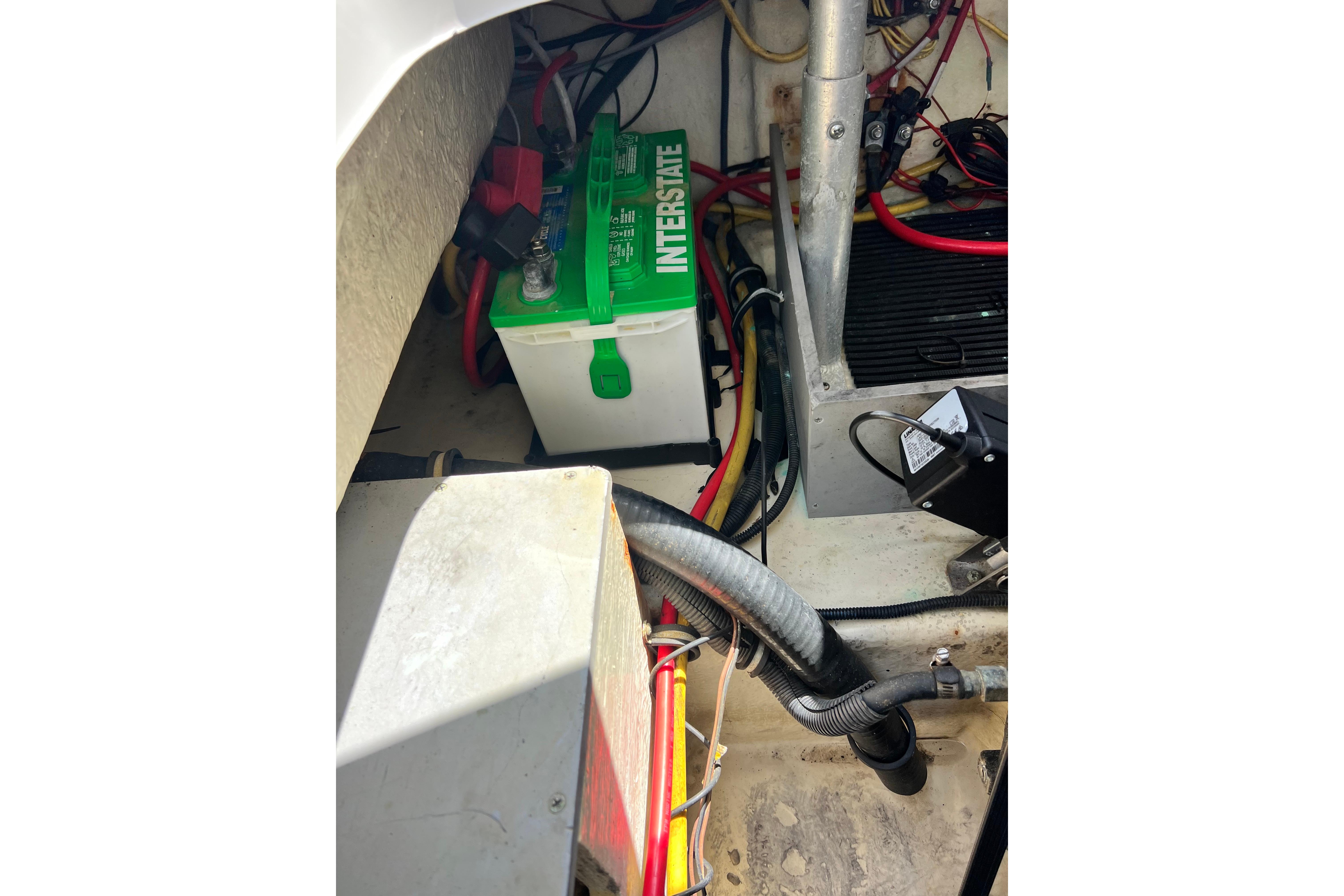 Battery compartment of a 2015 Monterey 268SS Super Sport boat, featuring an Interstate battery.
