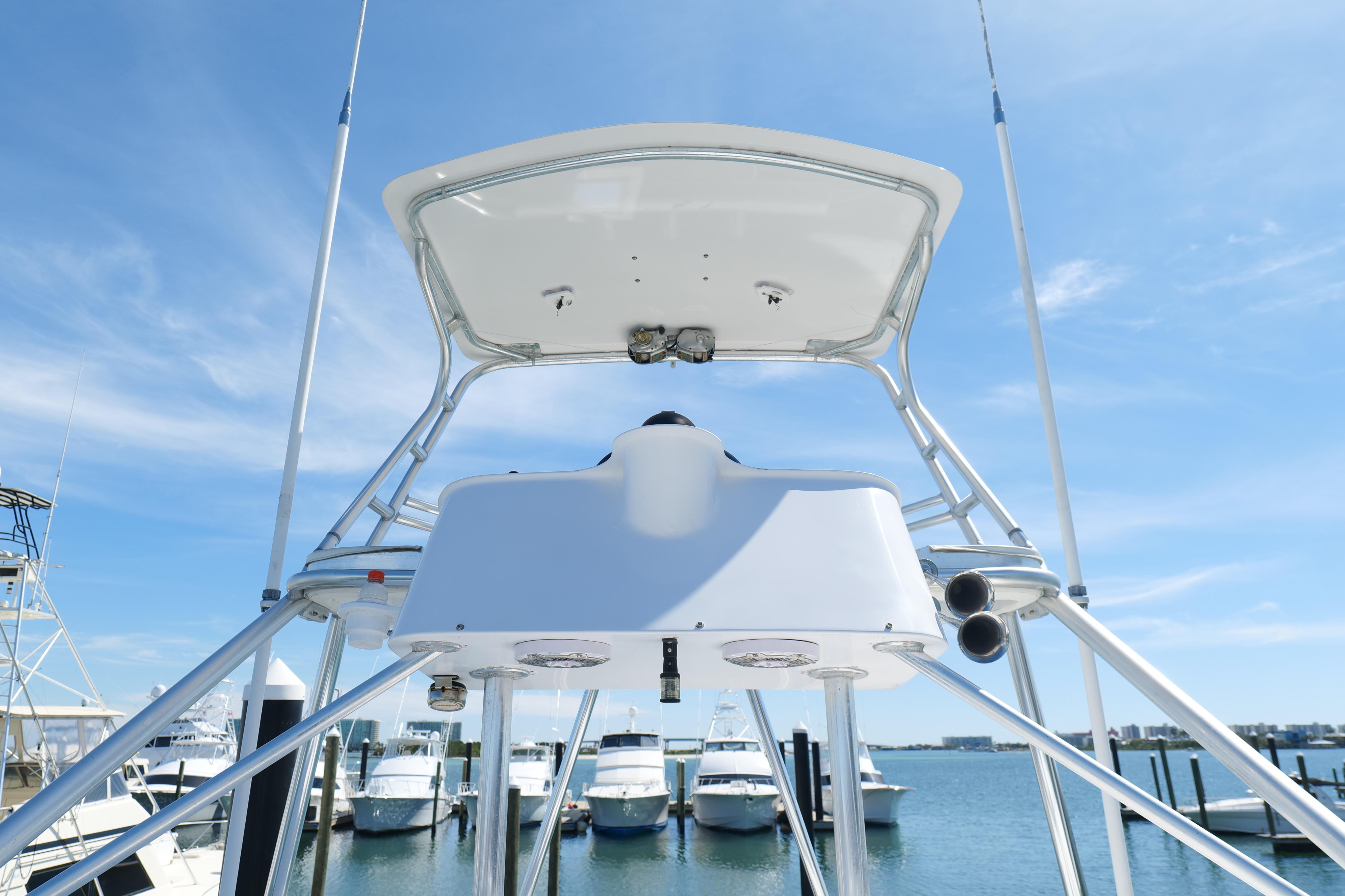 Cabo 45 Express 1998 boat tower with blue sky and marina background.