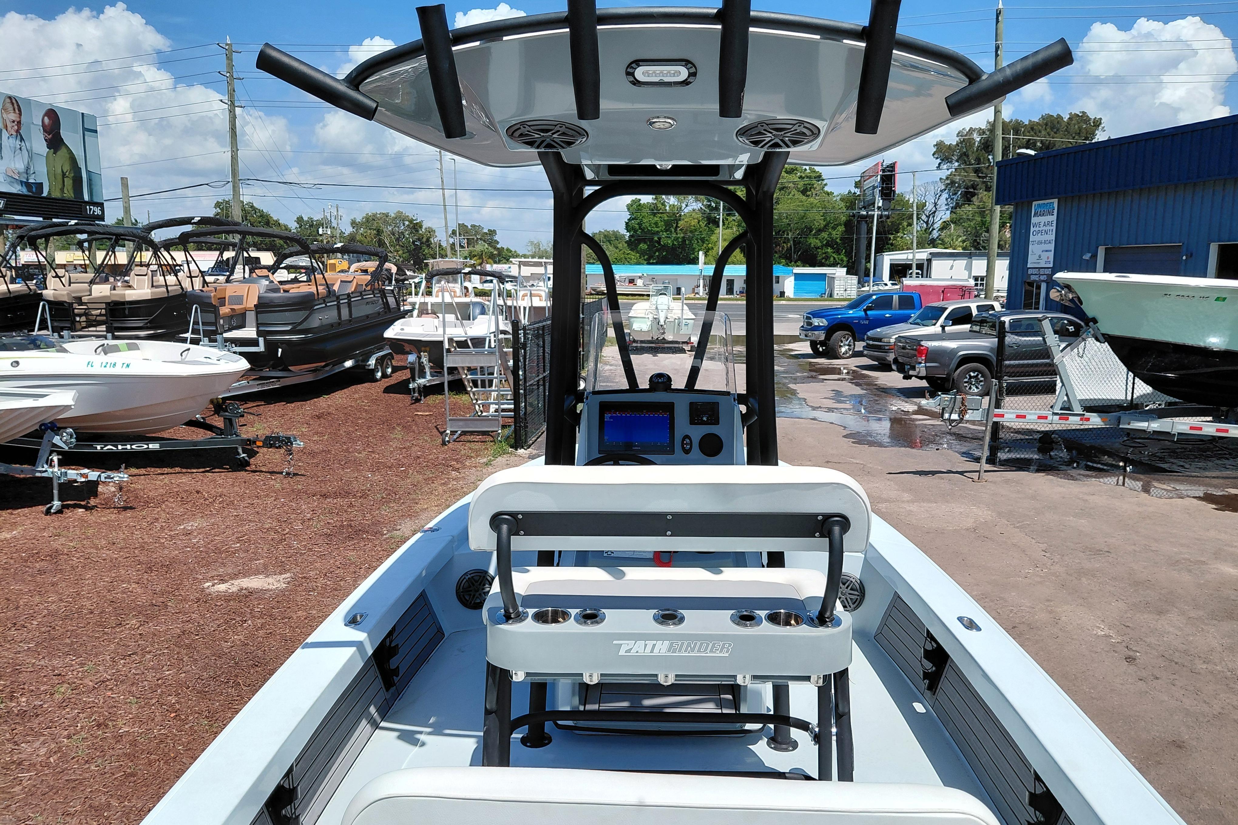 2022 Pathfinder 2300 HPS boat displayed at a dealership with other boats.
