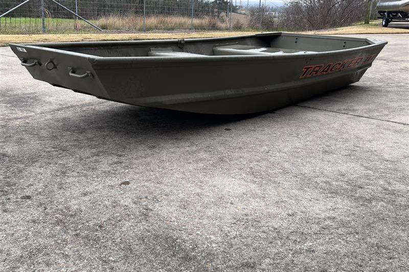 2026 Tracker Grizzly 10 Jon boat on concrete surface, side view.