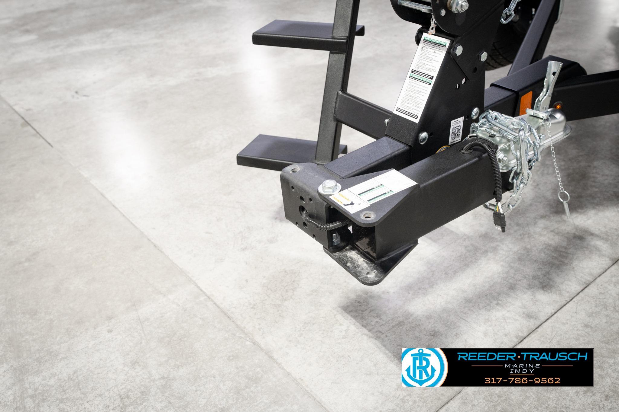 Trailer hitch of 2026 Lund 1775 Impact XS SS boat on showroom floor.