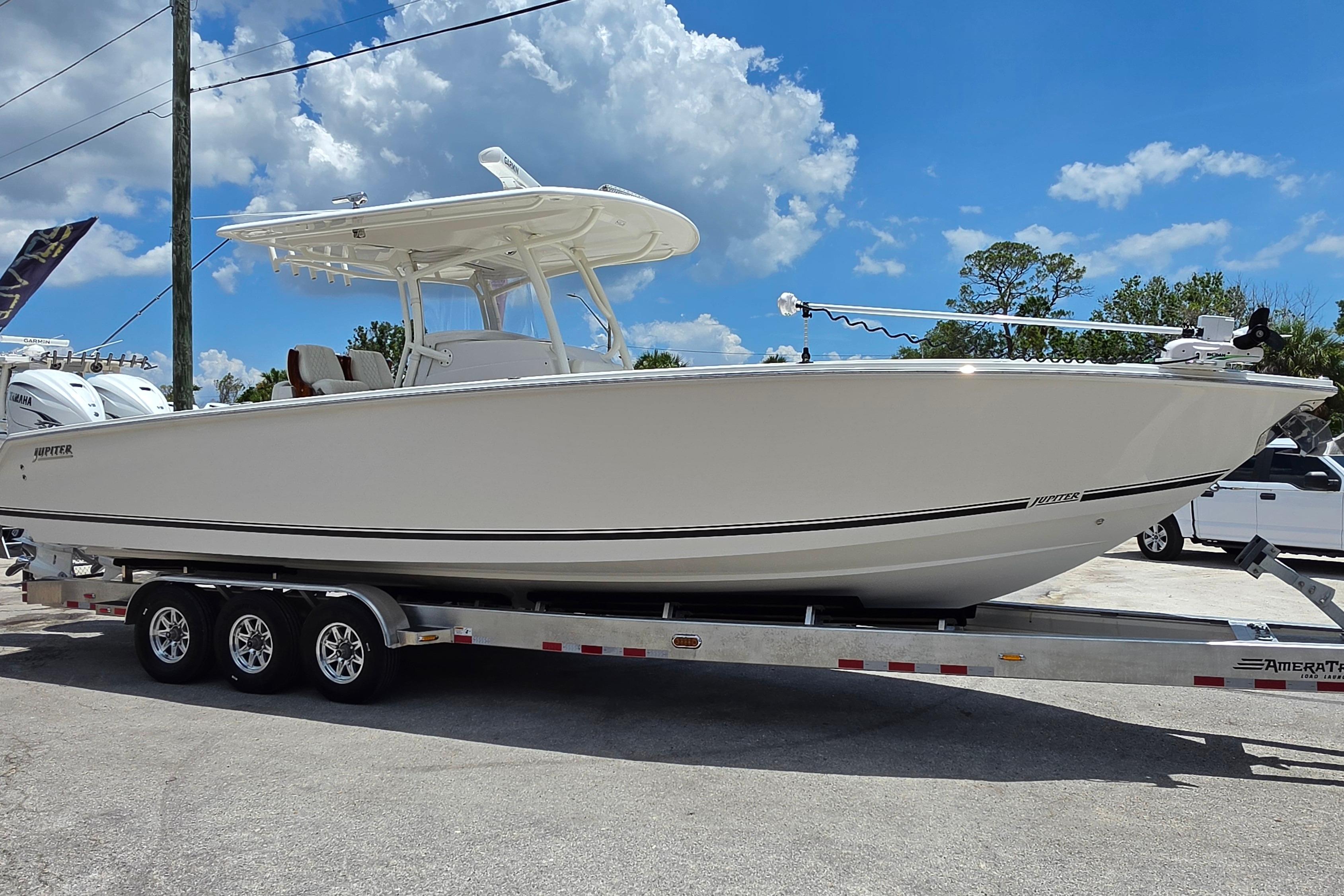 2020 Jupiter 34 HFS boat on trailer under blue sky.