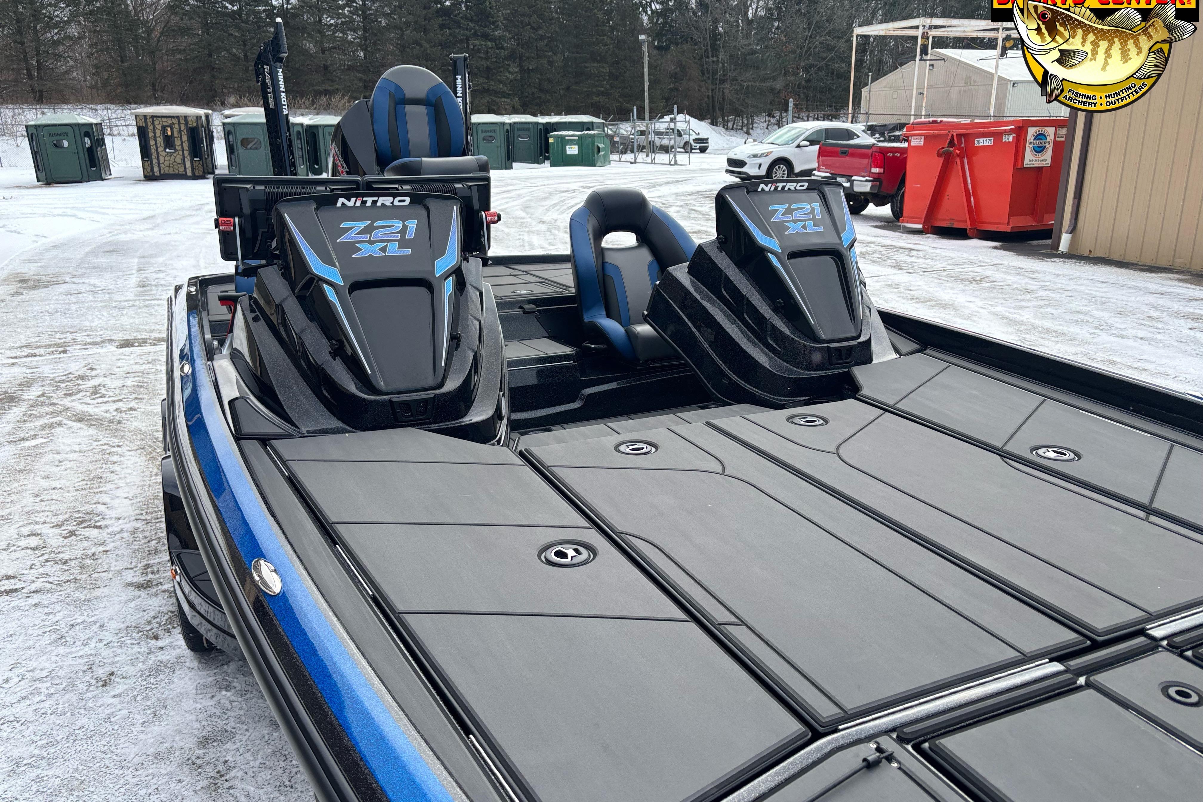 2026 Nitro Z21 XL boat with sleek black and blue design on snowy ground.