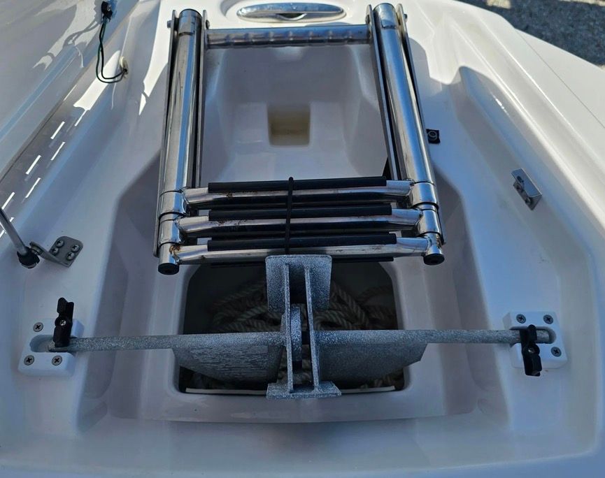 Yamaha Boats 252SD 2022 anchor compartment with ladder.