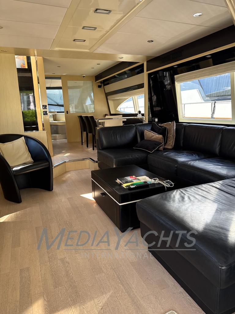 Luxurious interior of 2007 Riva Venere 75 yacht with modern black leather seating.