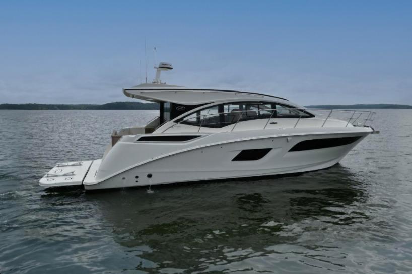 2017 Sea Ray Sundancer 400 yacht on calm water under a clear sky.