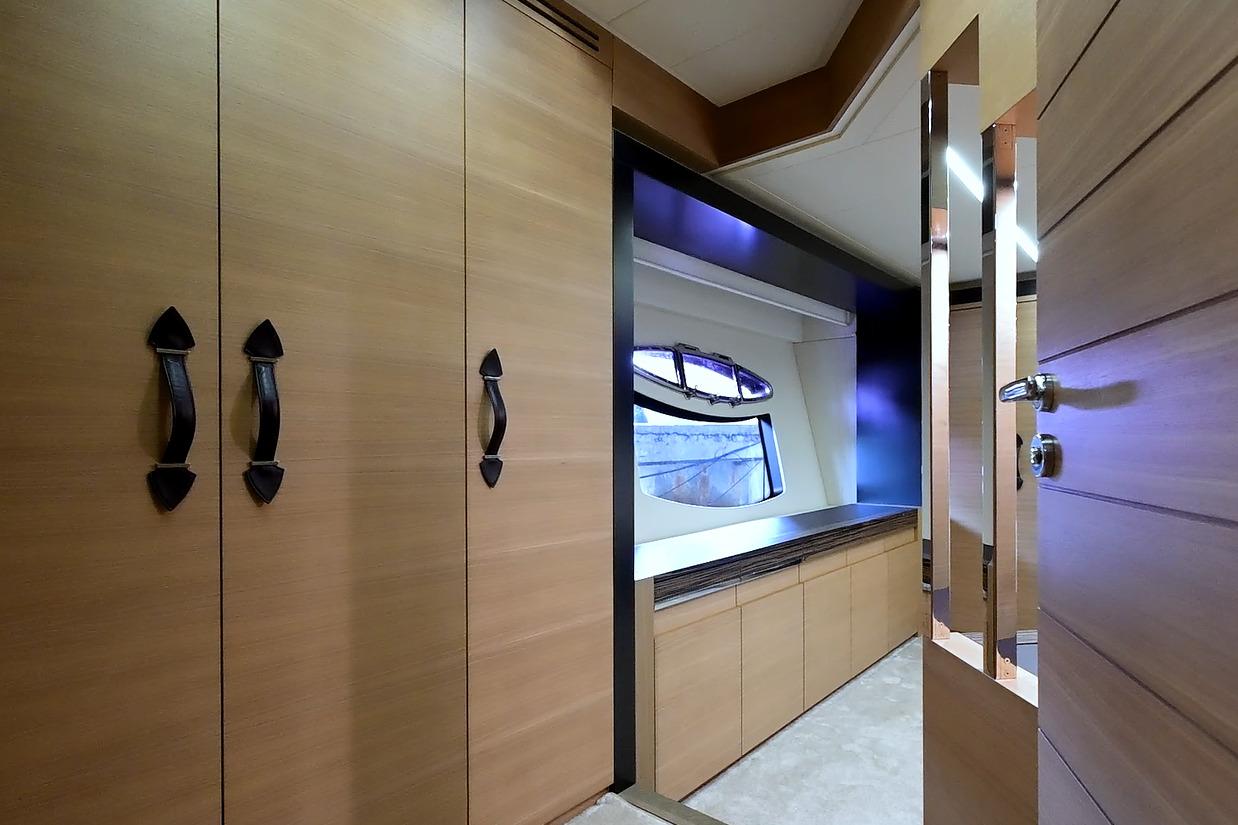 Luxurious interior of 2015 Pershing 92 yacht with sleek wood finishes and modern design.