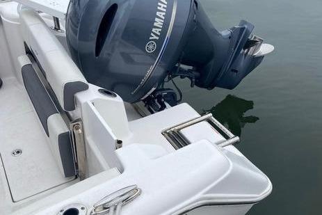 2020 Tidewater 220 CC boat with Yamaha outboard motor on calm water.