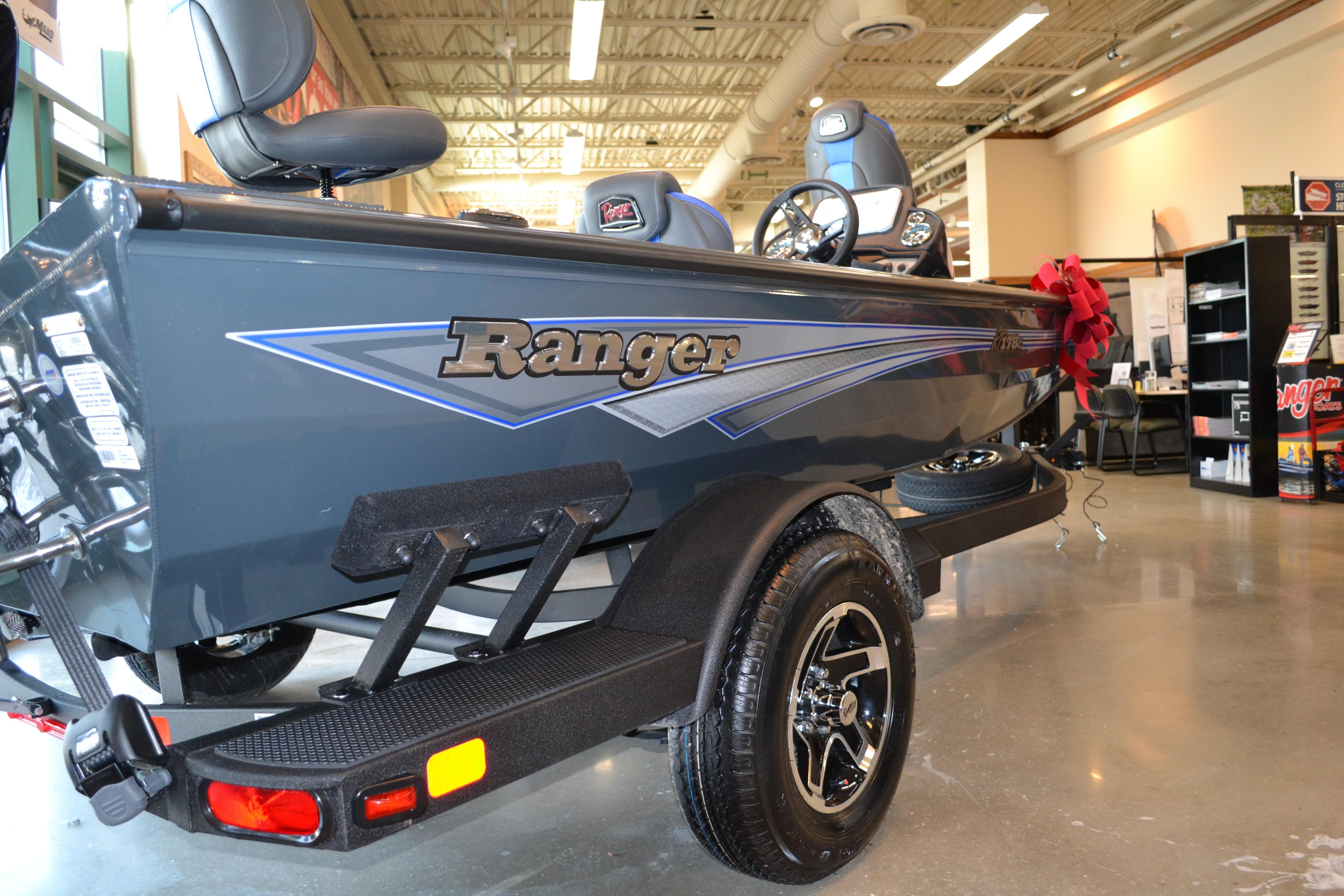 2026 Ranger RT178C boat displayed indoors with sleek design and modern features.