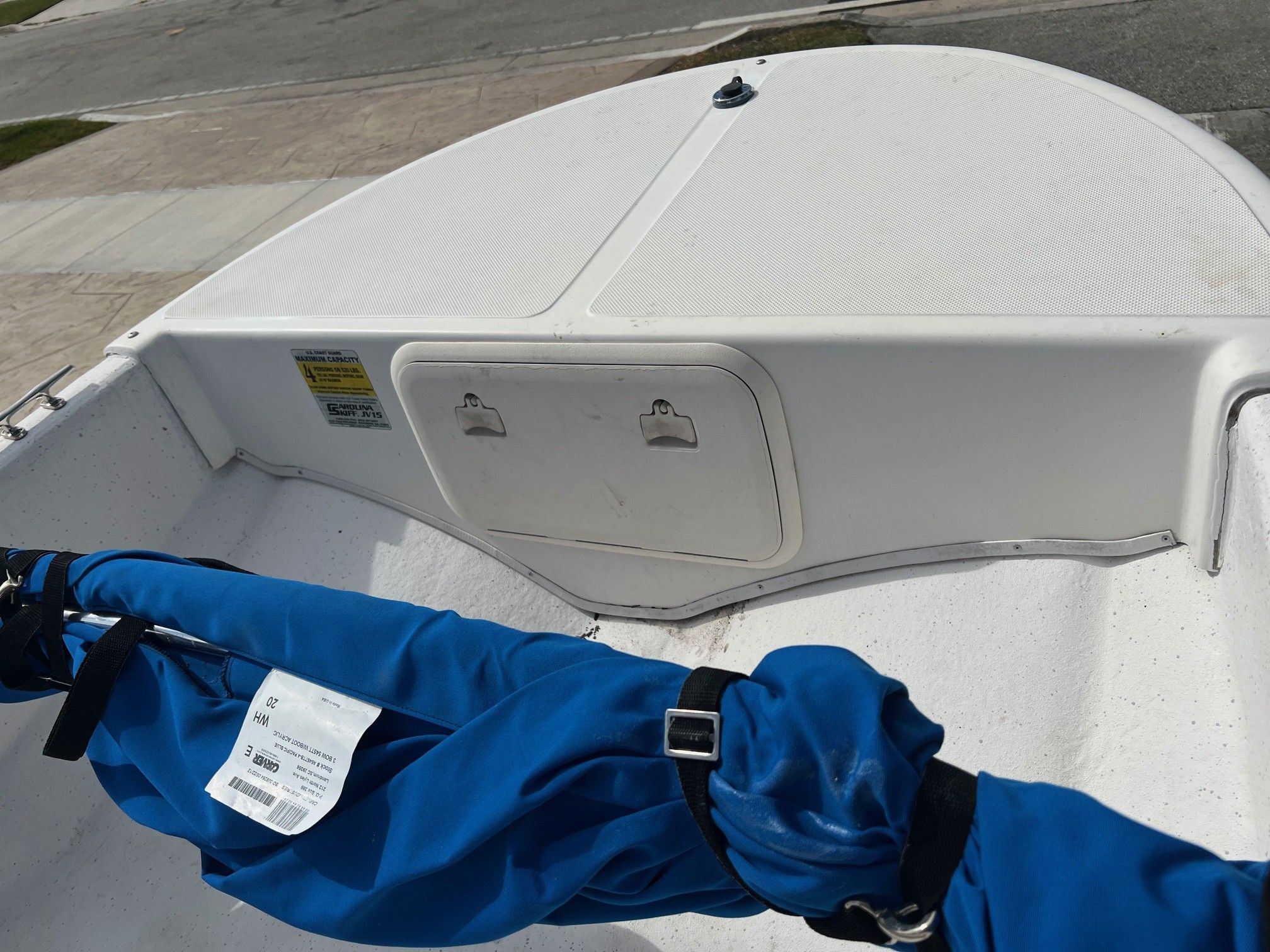 2007 Carolina Skiff JV15 boat with blue cover.