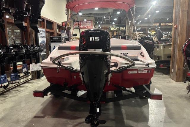 2026 Tahoe T18 boat with Mercury 115 engine displayed indoors.