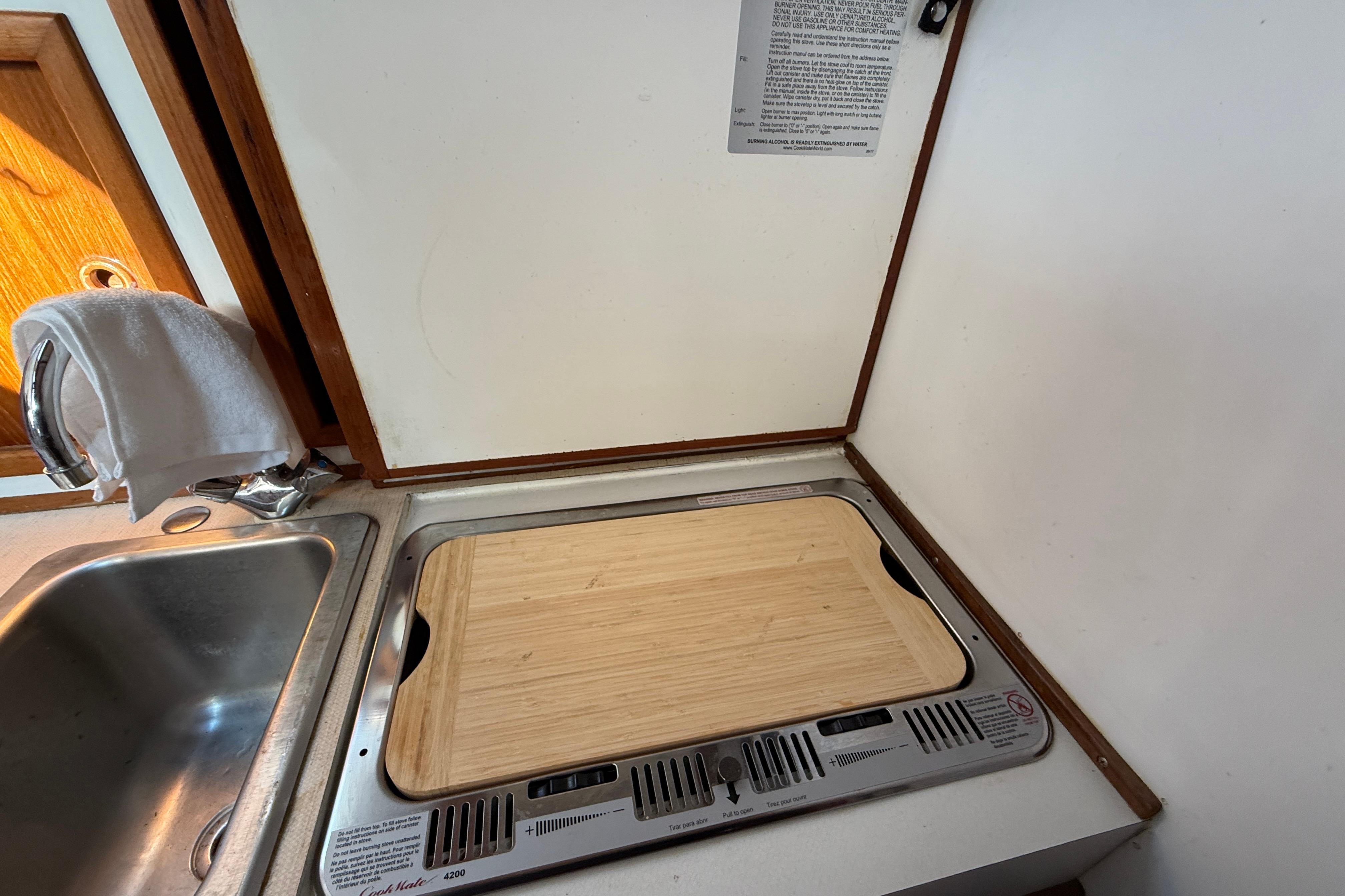 1983 Wilbur 34 Fly Bridge Cruiser kitchen with sink and stove.