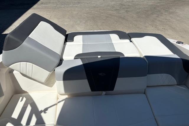 2023 Chaparral 21 SSi boat interior with gray and white cushioned seating.