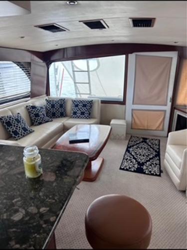 Luxurious interior of a 1986 Egg Harbor 60 Sportfisherman yacht with elegant seating and decor.