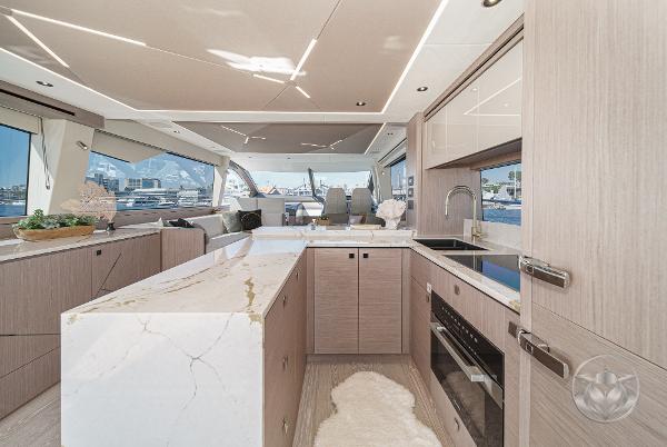 Luxurious interior of 2025 Sunseeker Manhattan 68 yacht with modern kitchen design.