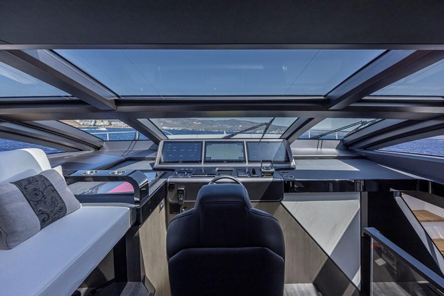 Luxurious Pearl 82 yacht cockpit with panoramic windows, advanced navigation systems, and sleek design, 2026 model.