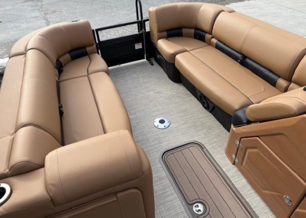 2025 Regency 230 LE3 boat interior with tan seating and spacious layout.