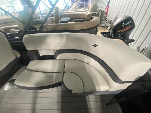2024 Starcraft EXS 1 boat interior with beige seating and Yamaha outboard motor.