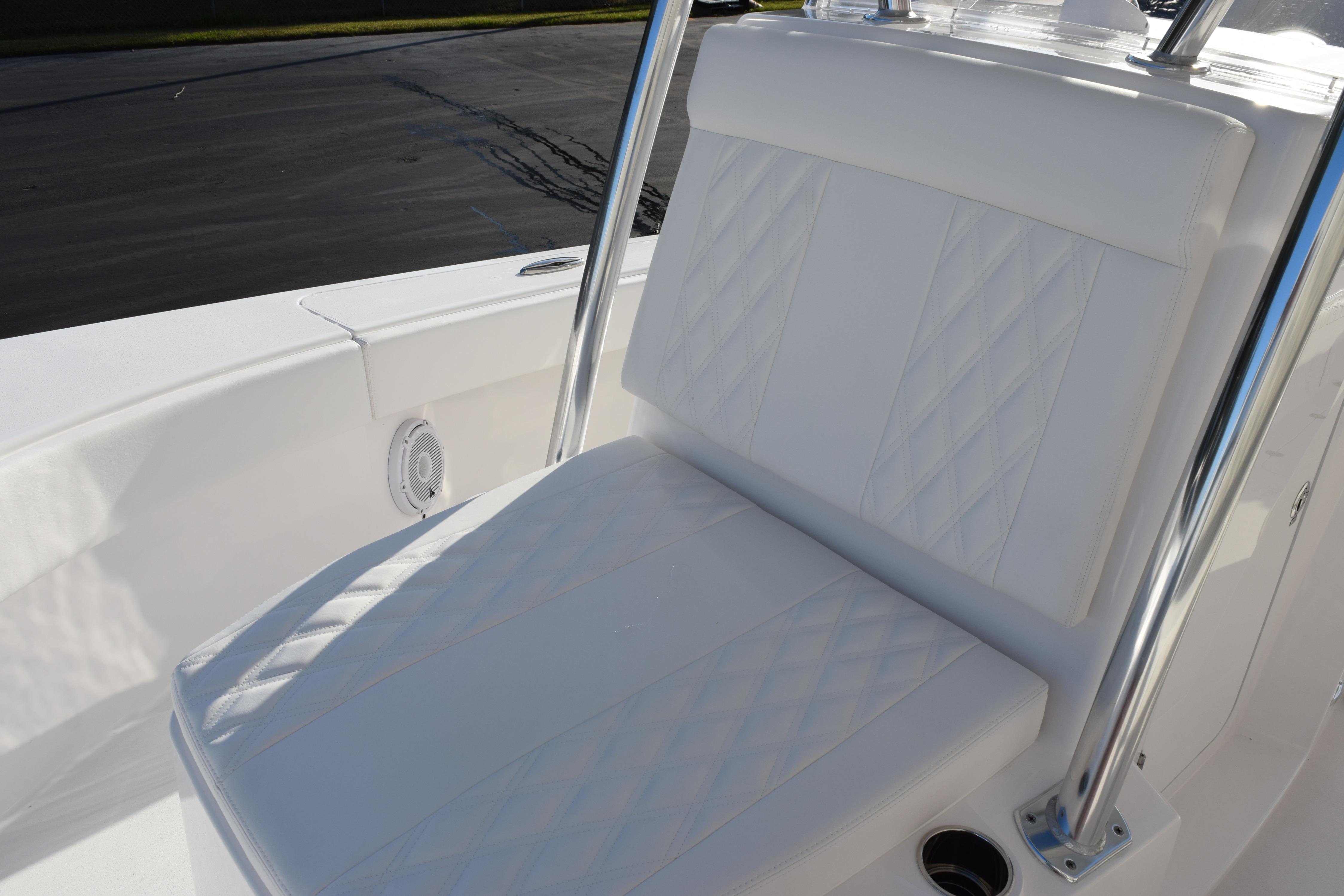 2026 Contender 29 Bay boat with white cushioned seating and stainless steel frame.