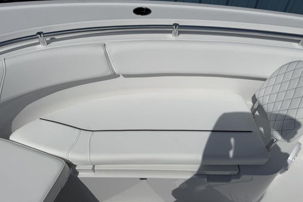 2026 Sportsman Open 252 Center Console boat interior with white cushioned seating.