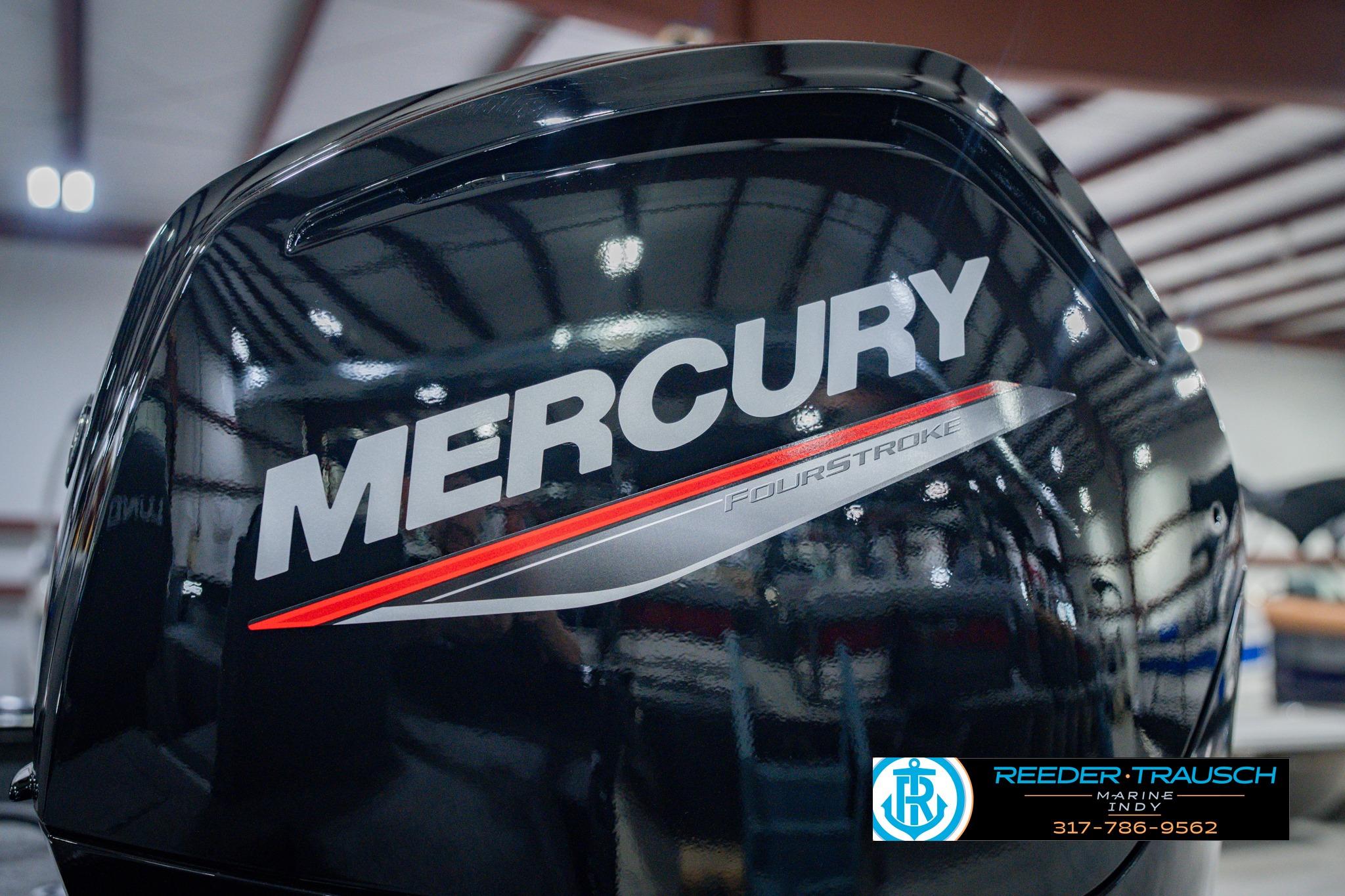 2026 Lund 1775 Impact XS with Mercury FourStroke engine in a showroom.