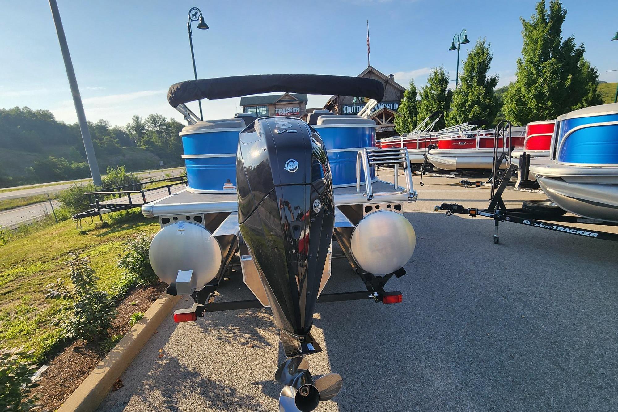 2026 Sun Tracker Party Barge 22 XP3 pontoon boat with powerful outboard motor.