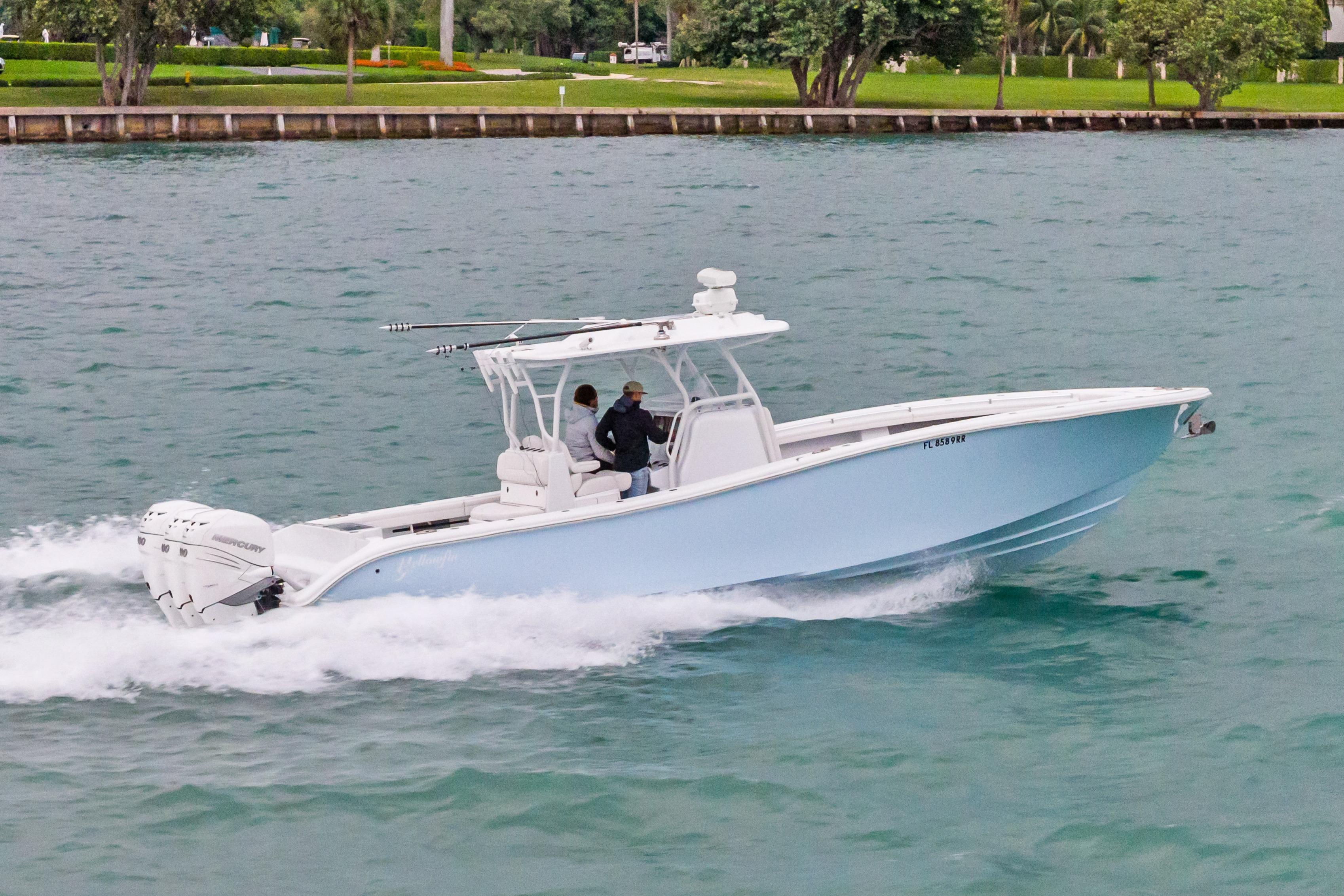 2021 Yellowfin 36 Offshore boat cruising on water, side view.