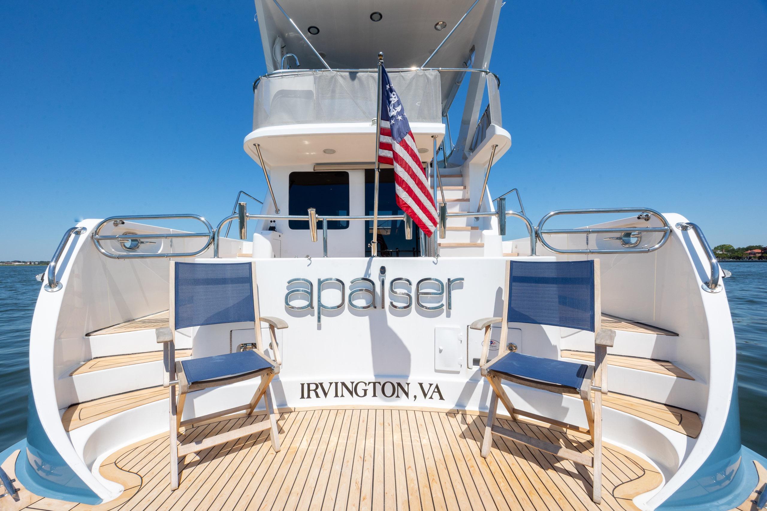 2005 Ocean Alexander 52 Sedan yacht with American flag, docked in Irvington, VA.