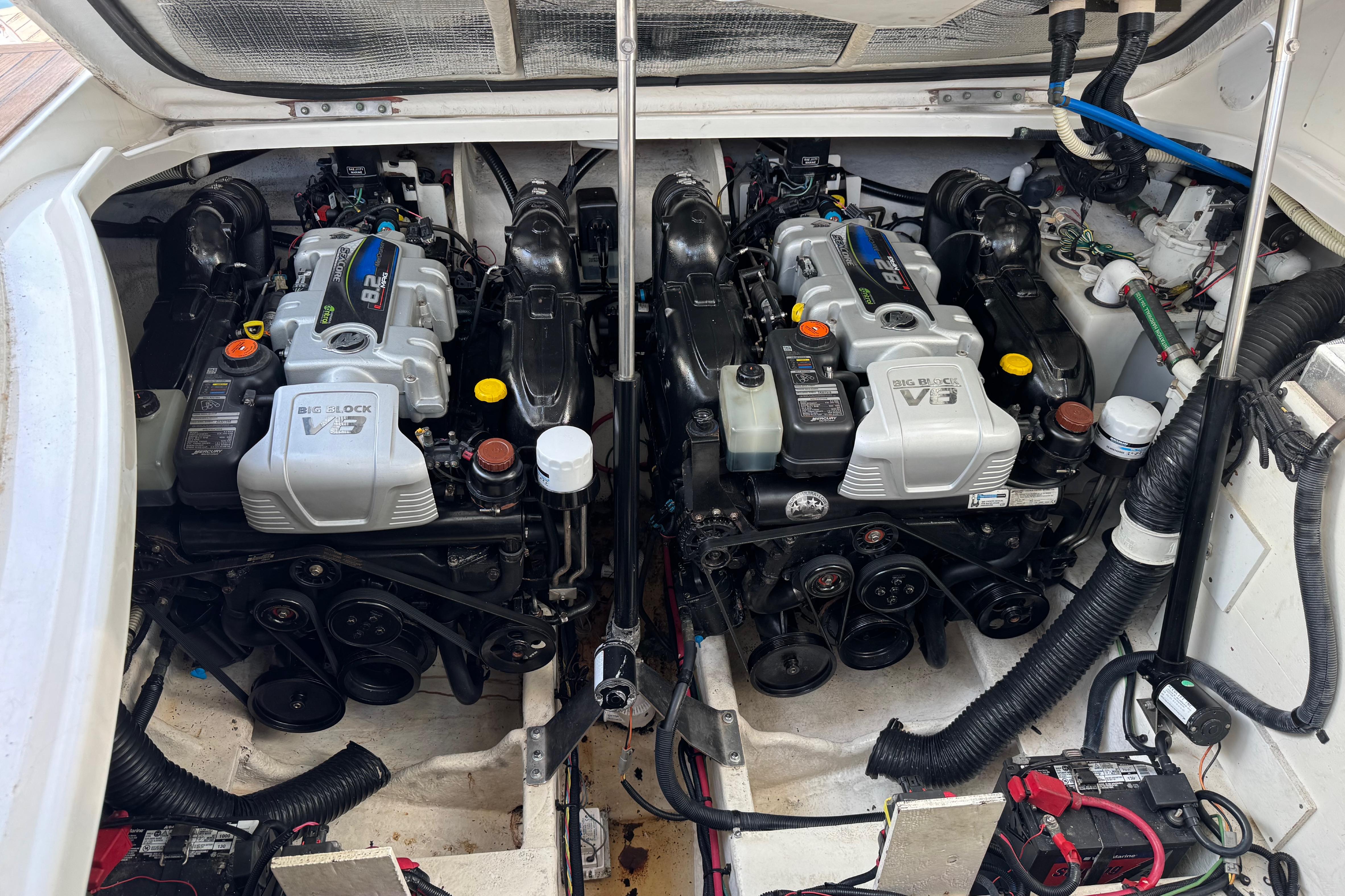 Engine compartment of a 2016 Sea Ray Sundancer 350 with dual V8 engines.