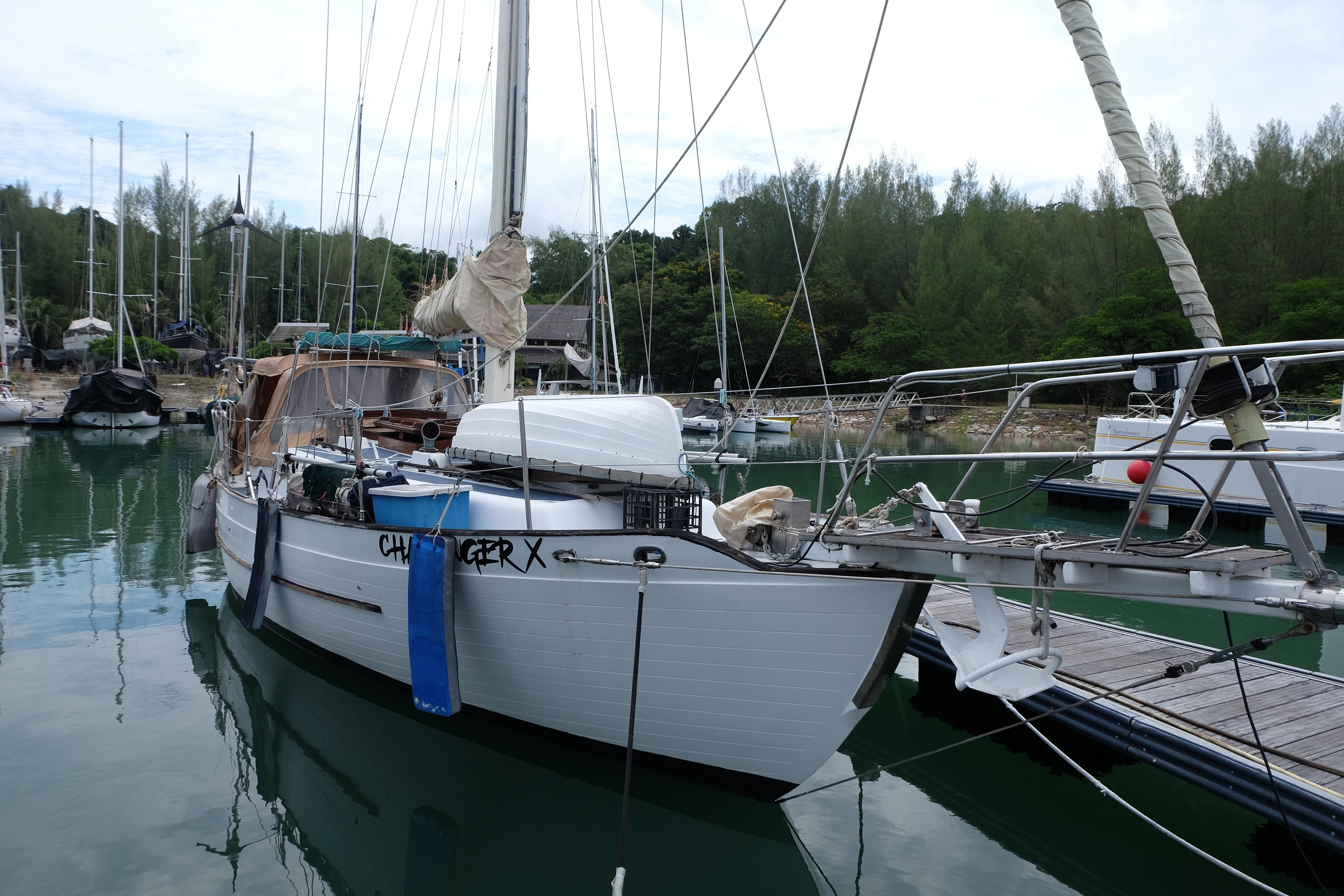 1979 Westwind 35 sailboat docked in a serene marina setting.