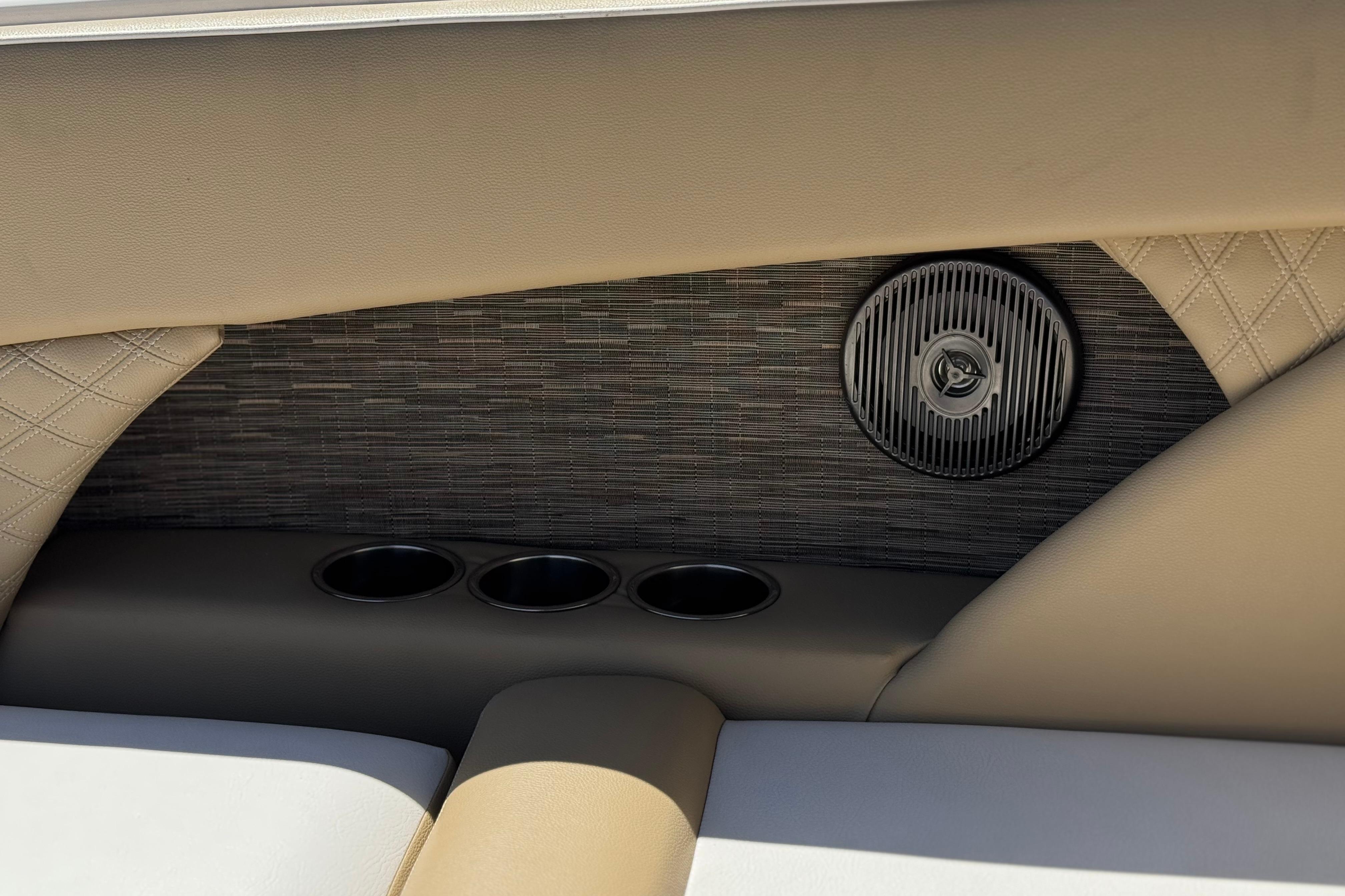 Interior of 2017 Scarab 255 H.O. Platinum boat with speaker and cup holders.