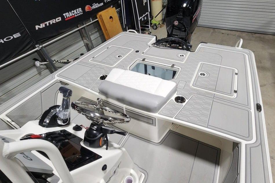 2026 Mako 18 Pro Skiff boat interior with steering console and seating.