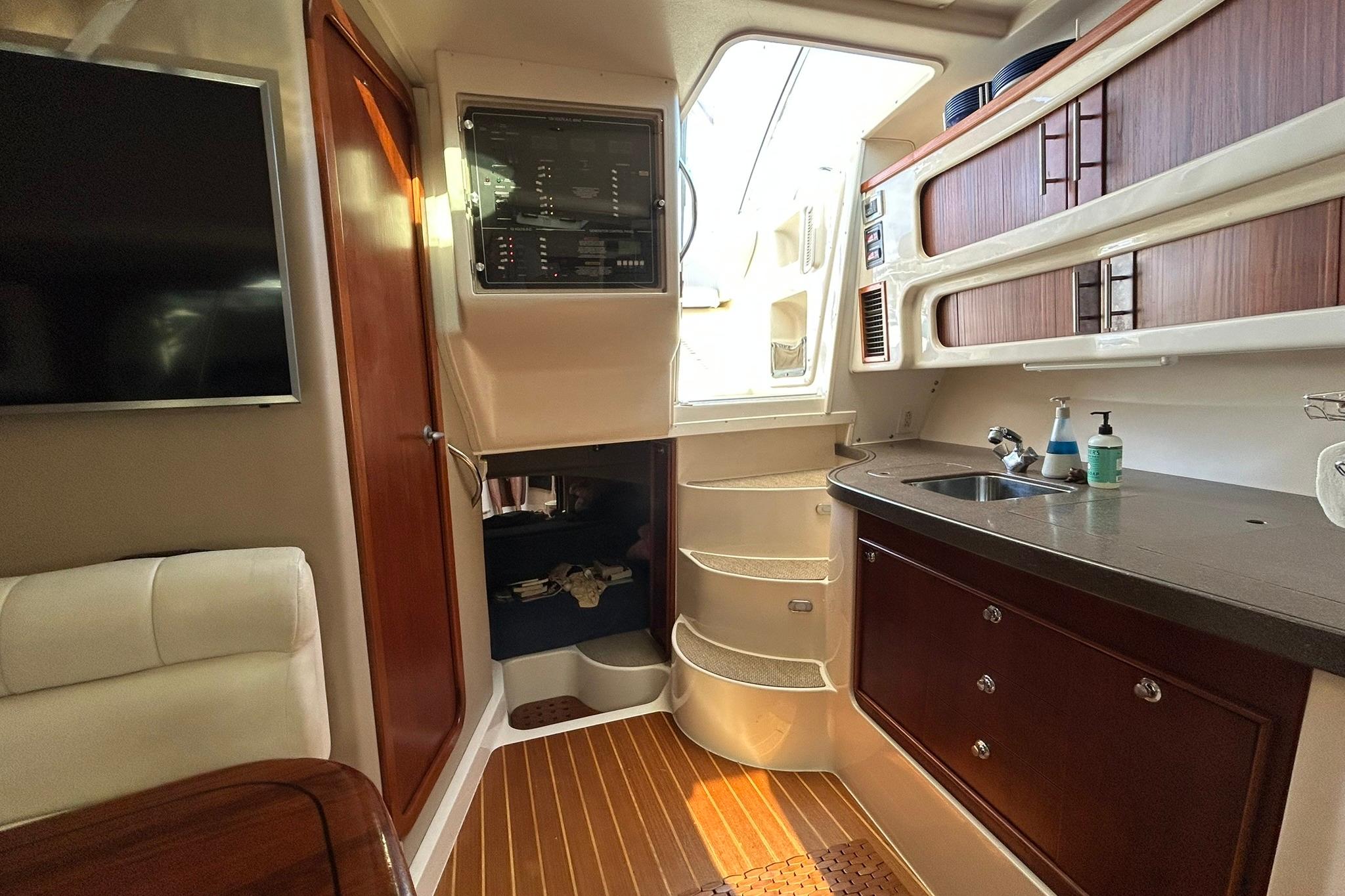 Interior of 2007 Grady-White Express 360 boat with kitchenette and seating area.