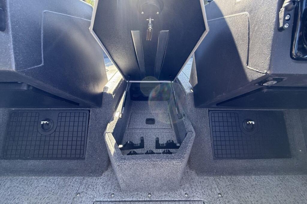 2024 Tracker Targa V-19 WT boat interior storage compartment, open and empty.