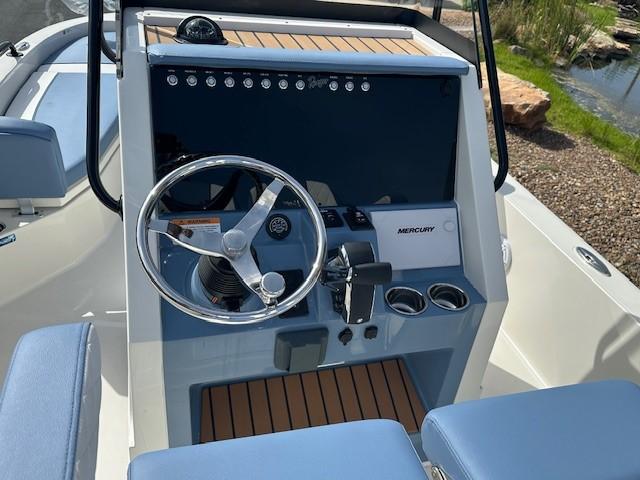 2025 Ranger 2360 Bay boat dashboard with steering wheel and Mercury controls.