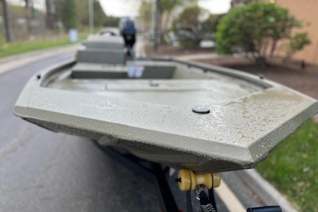 2026 Tracker Grizzly 1648 SC boat on trailer, close-up view, outdoors.