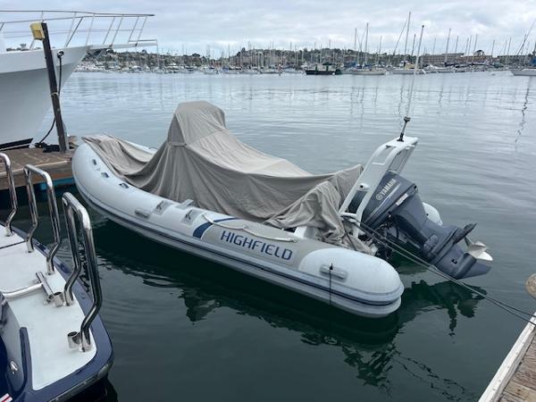 Highfield OM 500 inflatable boat docked, covered, with Yamaha outboard motor, 2017 model.