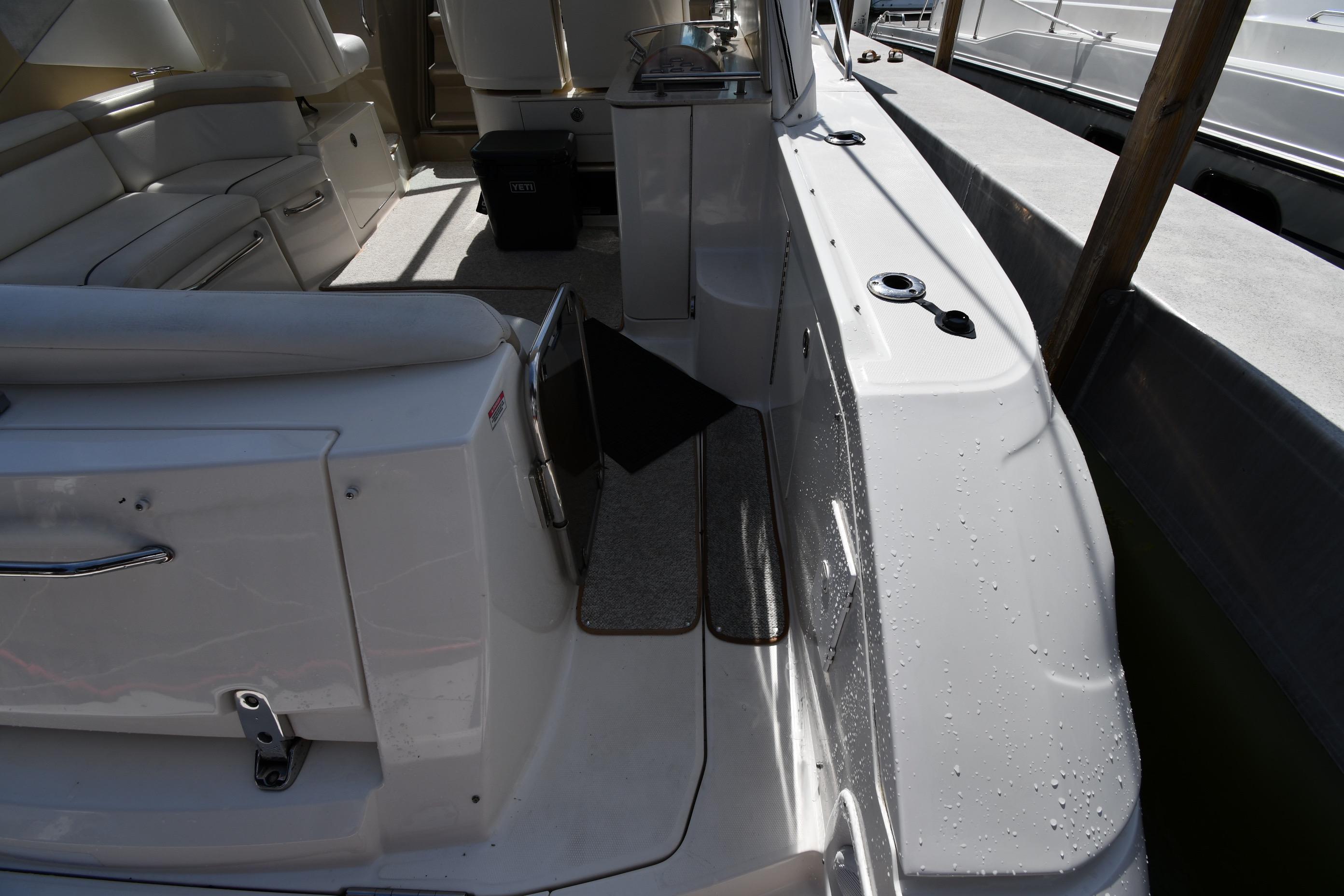 Interior view of a 2008 Sea Ray Sundancer 350 yacht, featuring seating and deck area.