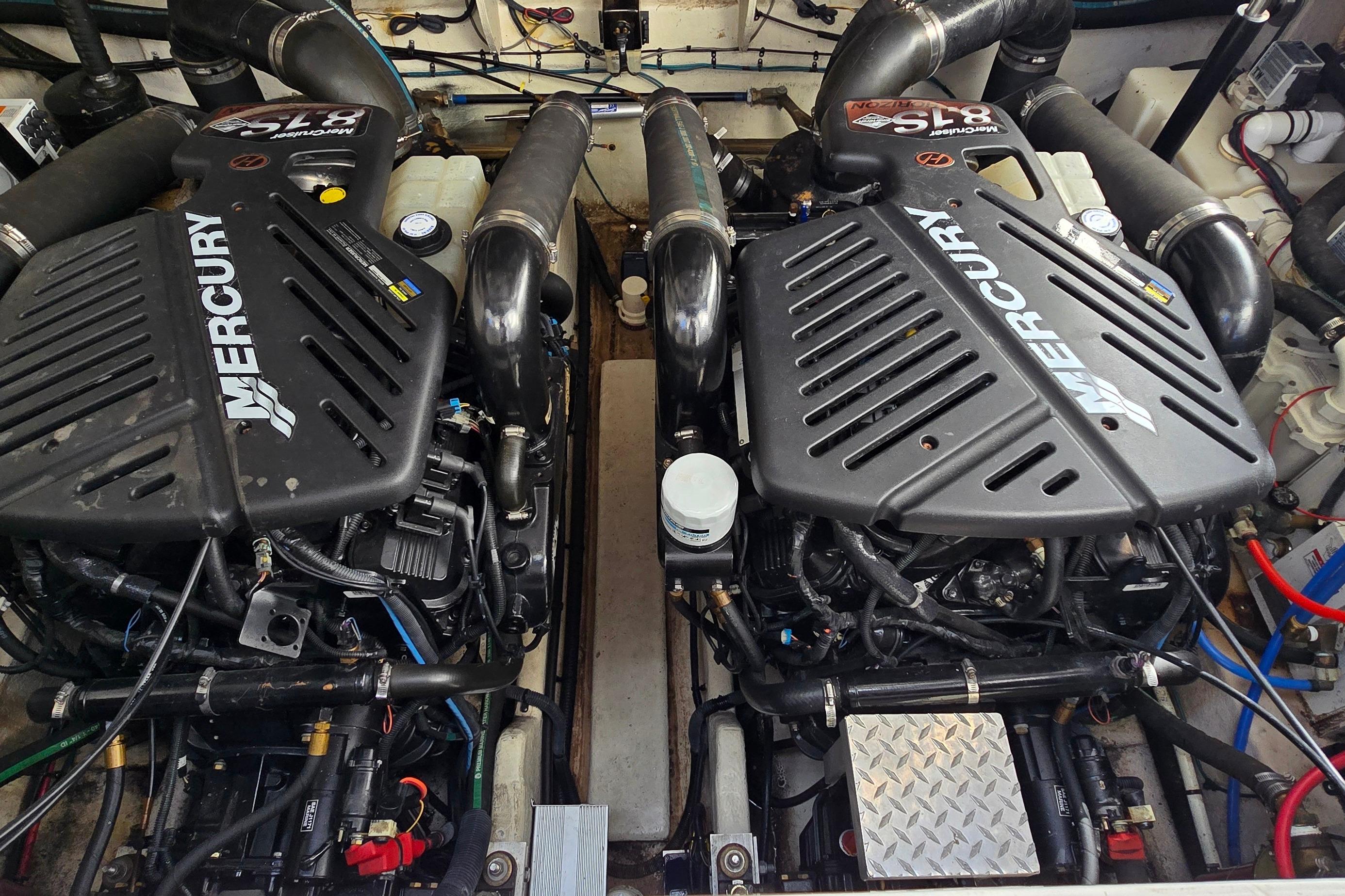 Twin Mercury engines in a 2007 Sea Ray 340 Sundancer boat engine compartment.