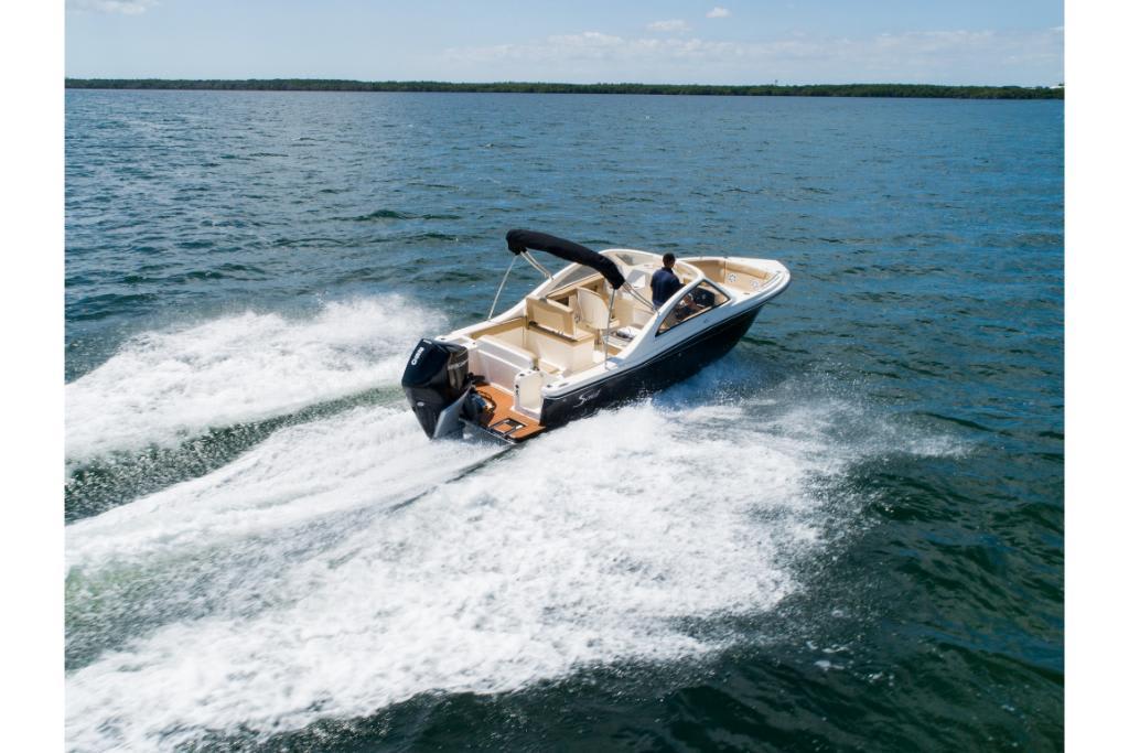 2023 Scout 240 Dorado boat cruising on open water.