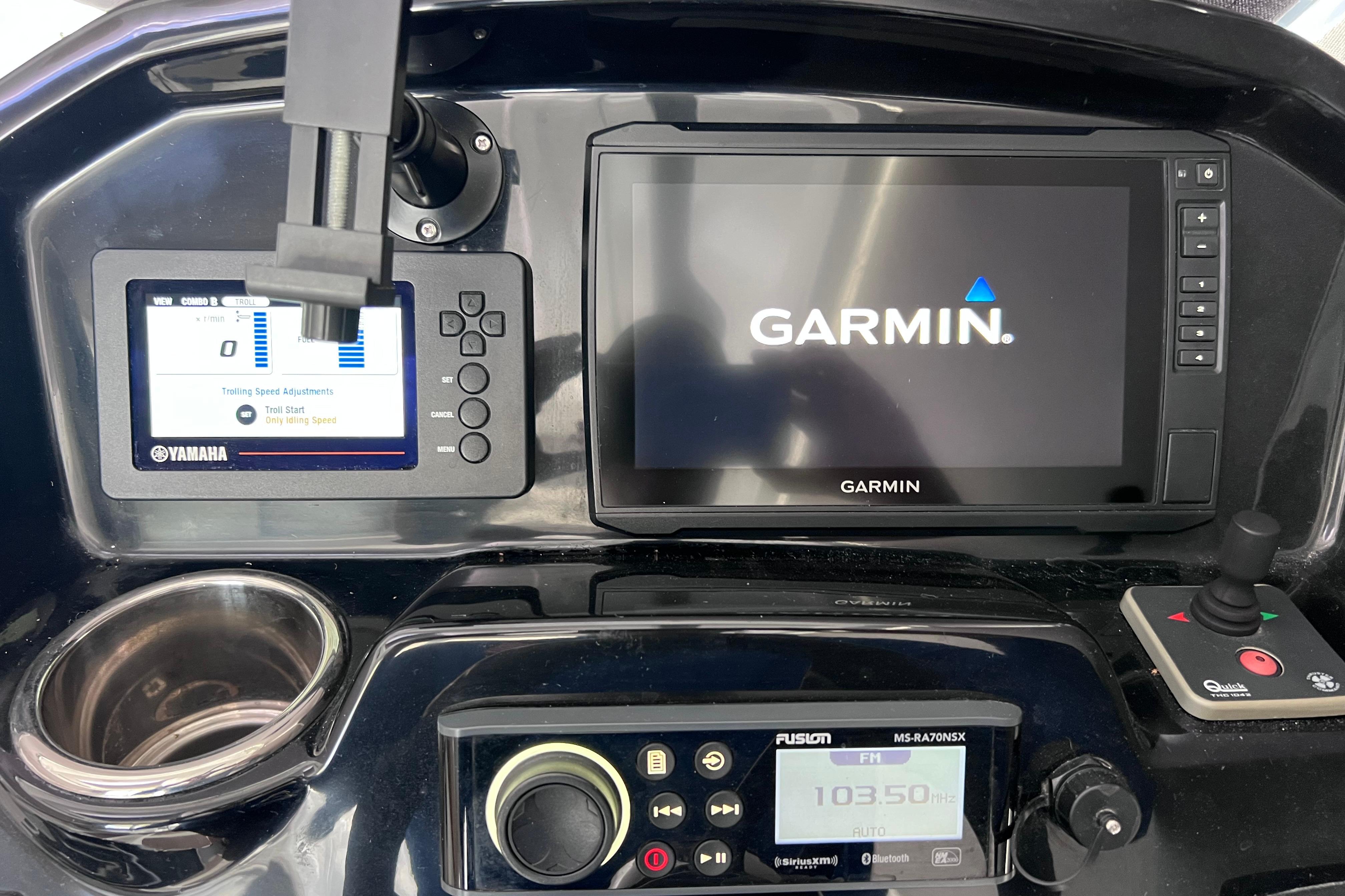 Dashboard of 2021 Jeanneau NC Weekender 795 Series 2 with Garmin and Yamaha displays.