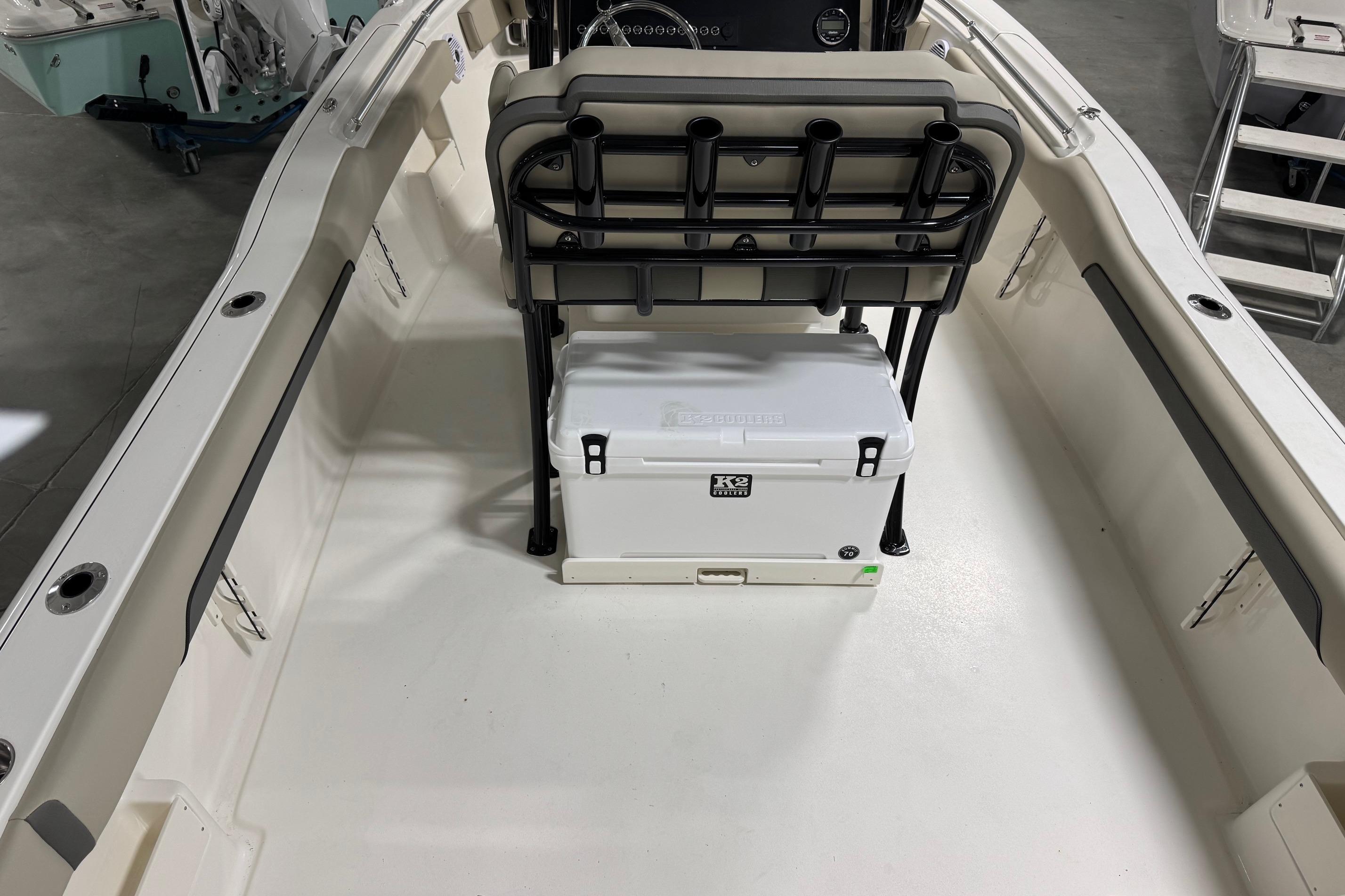 2026 Key West 239 FS boat interior with seating and cooler storage.