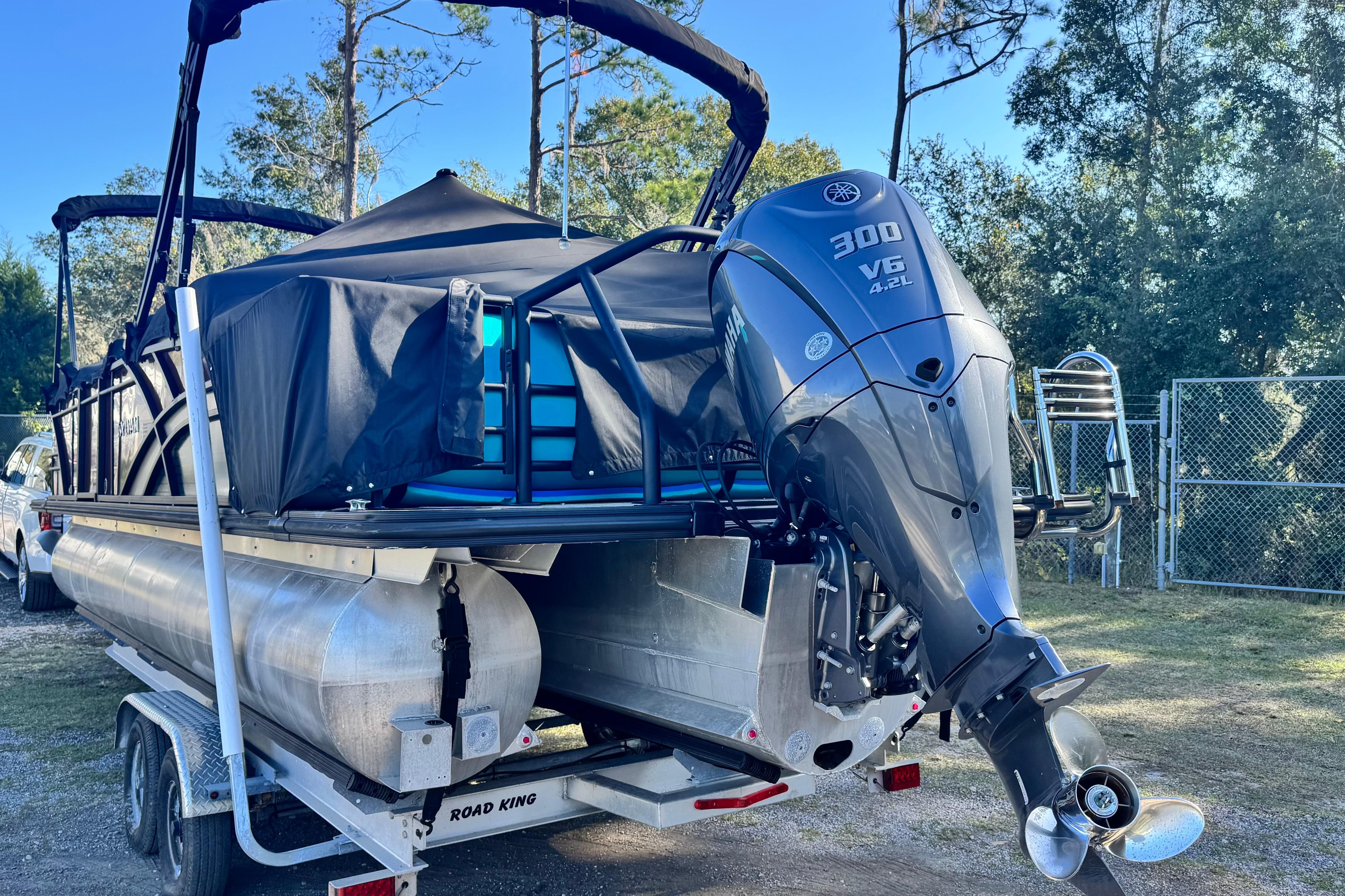 2023 Sylvan L5 CLZ pontoon boat with Yamaha 300 V6 engine on trailer.