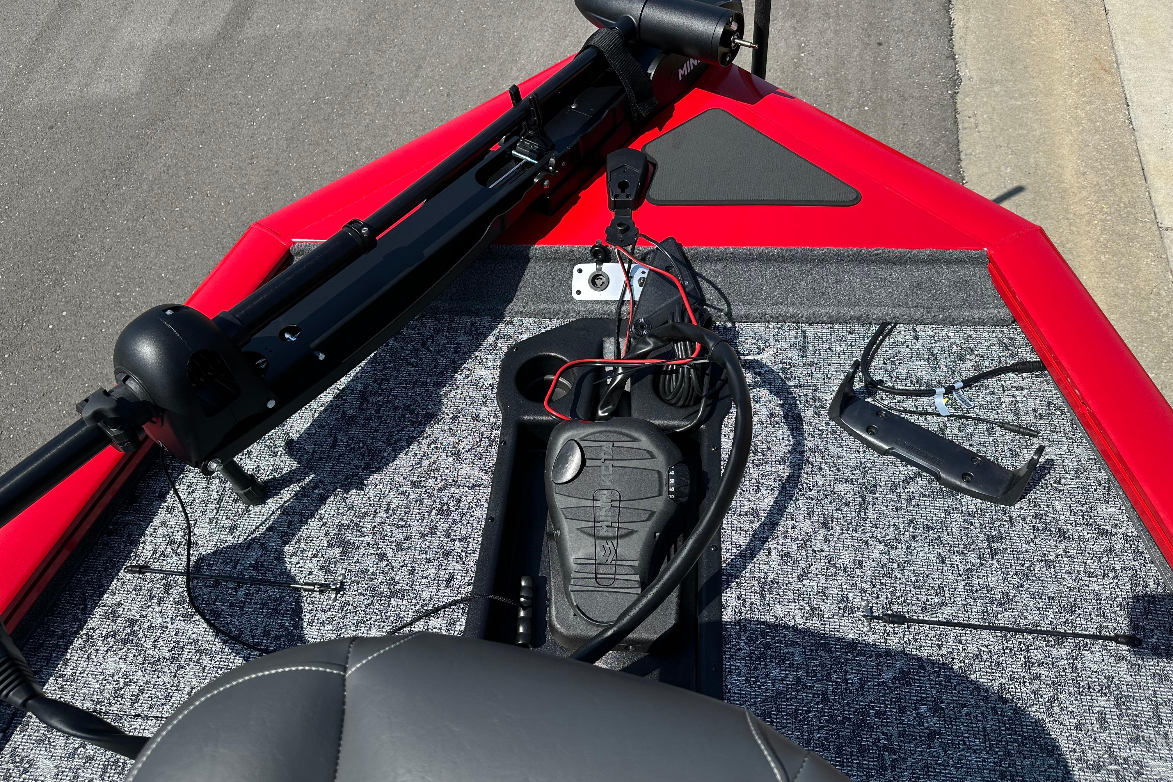 2026 Tracker Pro Team 195 boat deck with trolling motor and control panel.