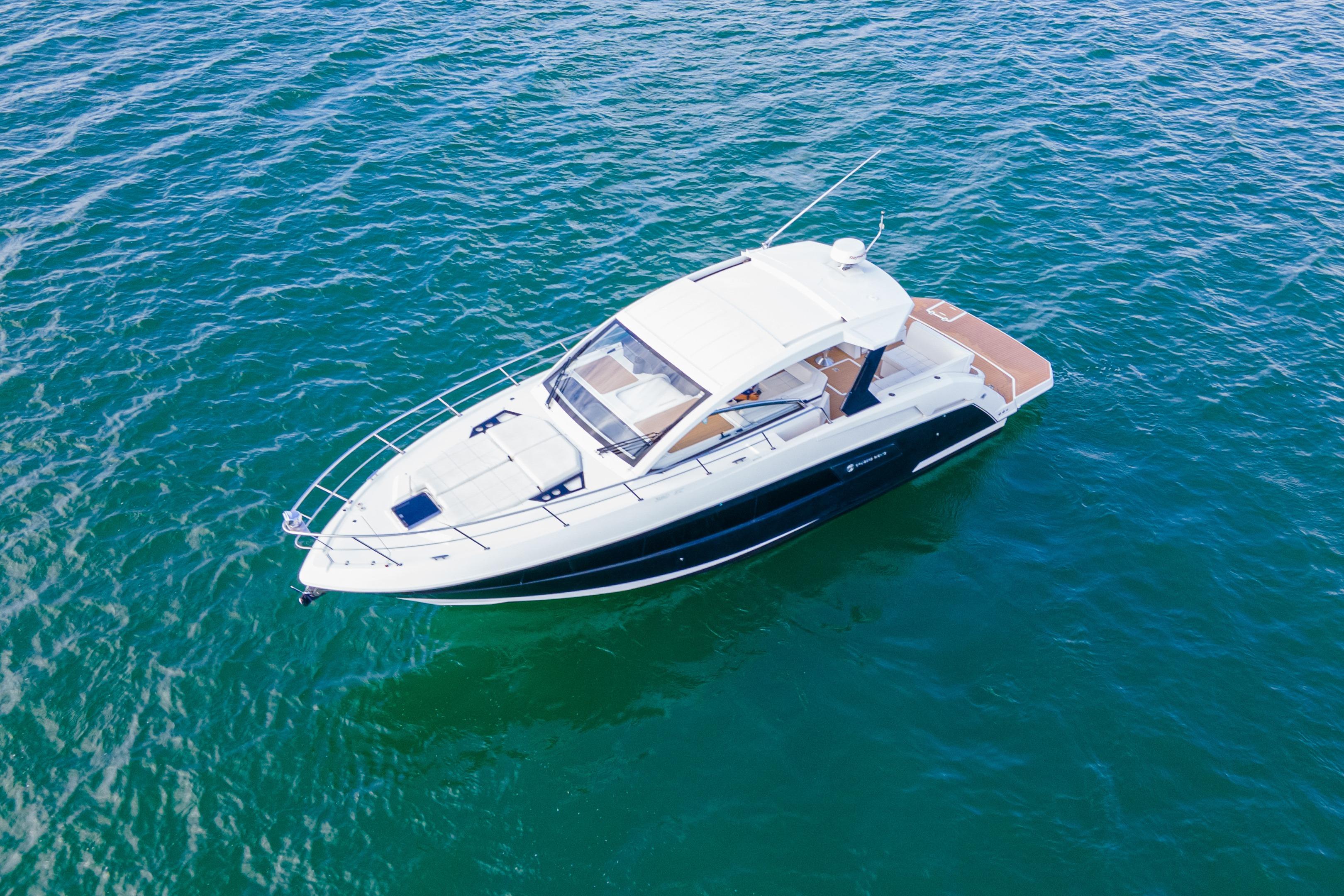 2018 Cruisers Yachts 390 Express Coupe on open water, aerial view.